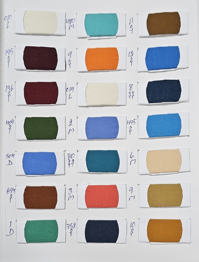 Twin Corn color chart page 4 with original fabric swatches and handwritten codes